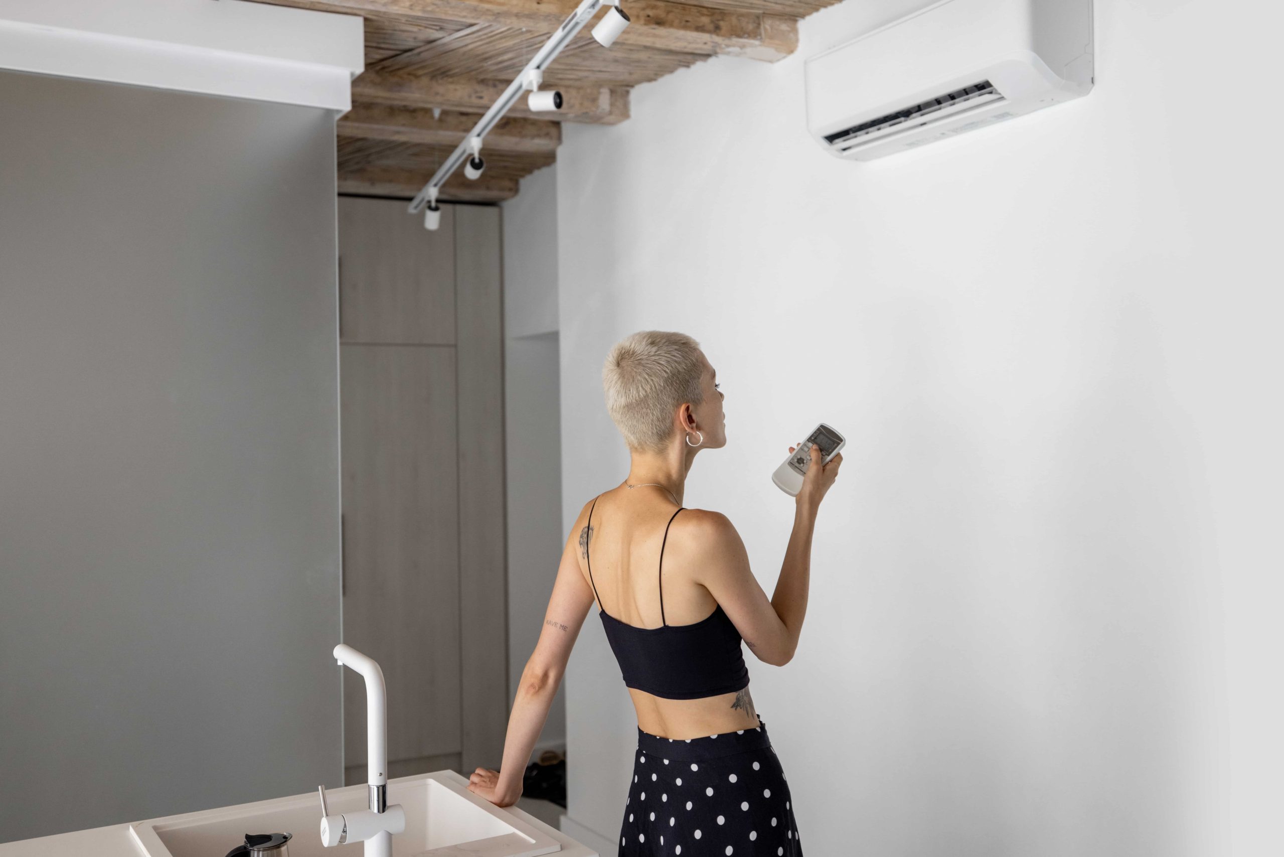 woman with a clean air conditioning unit