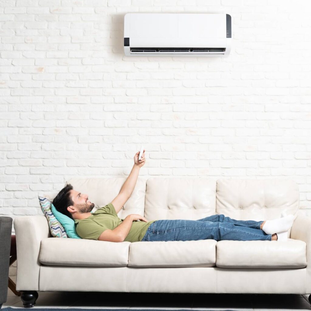 man enjoying his new hvac installation on the couch