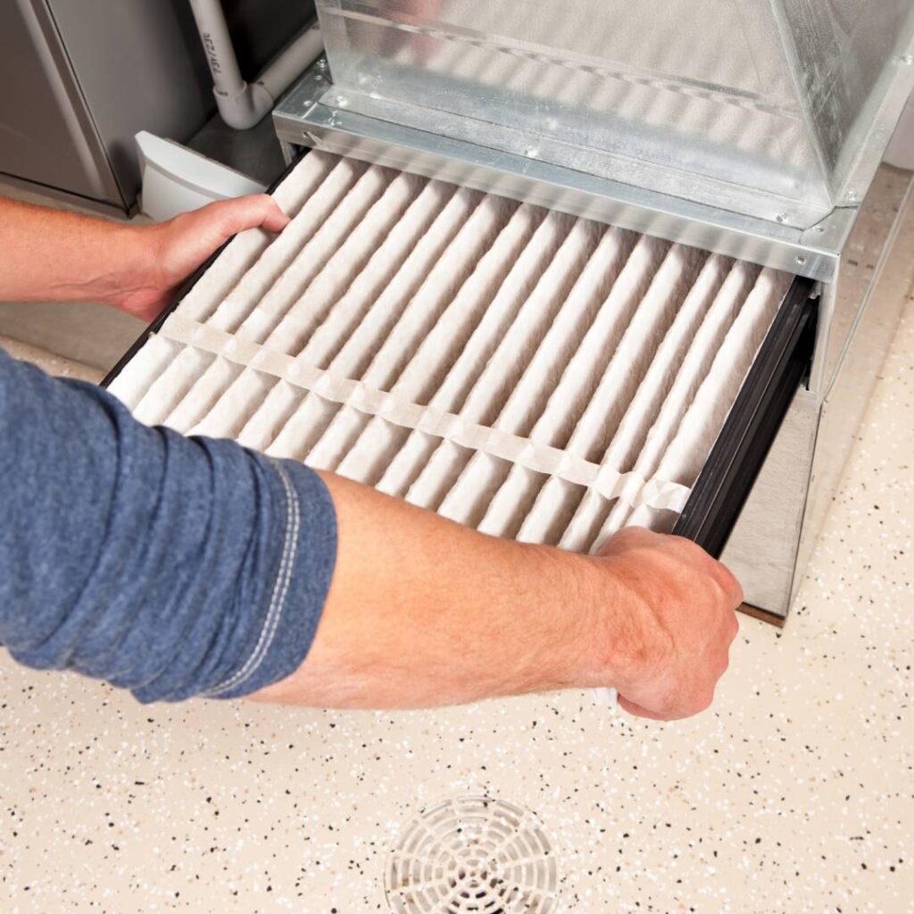 man changing Furnace Filters in 2023